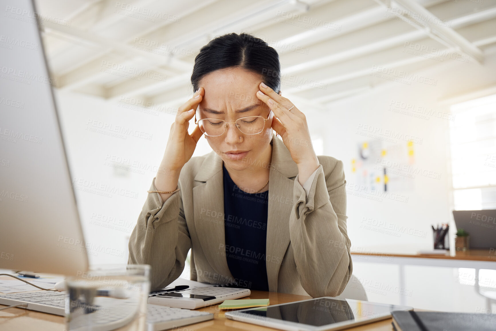 Buy stock photo Headache, stress and asian woman in office with problem, mistake or frustrated by computer, bankruptcy or deadline. Anxiety, migraine and Japanese person with brain fog or vertigo in audit or crisis