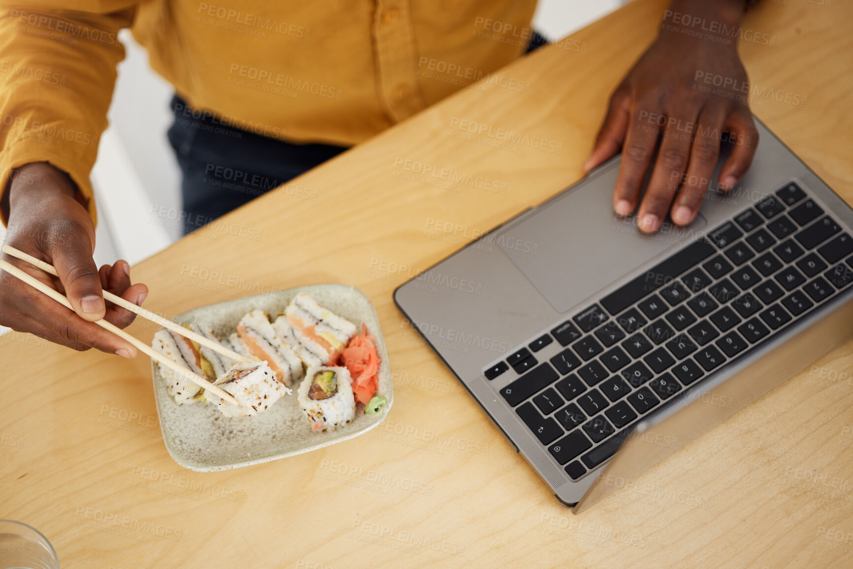 Buy stock photo Hands, business man and sushi with laptop, scroll and eating at desk, top view and search in modern office. Employee, computer and chopsticks for seafood, lunch or fish plate for health in workplace