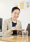Asian business woman, office and sushi on lunch break, video or movie on laptop with thinking, relax and happy. Japanese entrepreneur, eating seafood and smile with computer, chopsticks or streaming