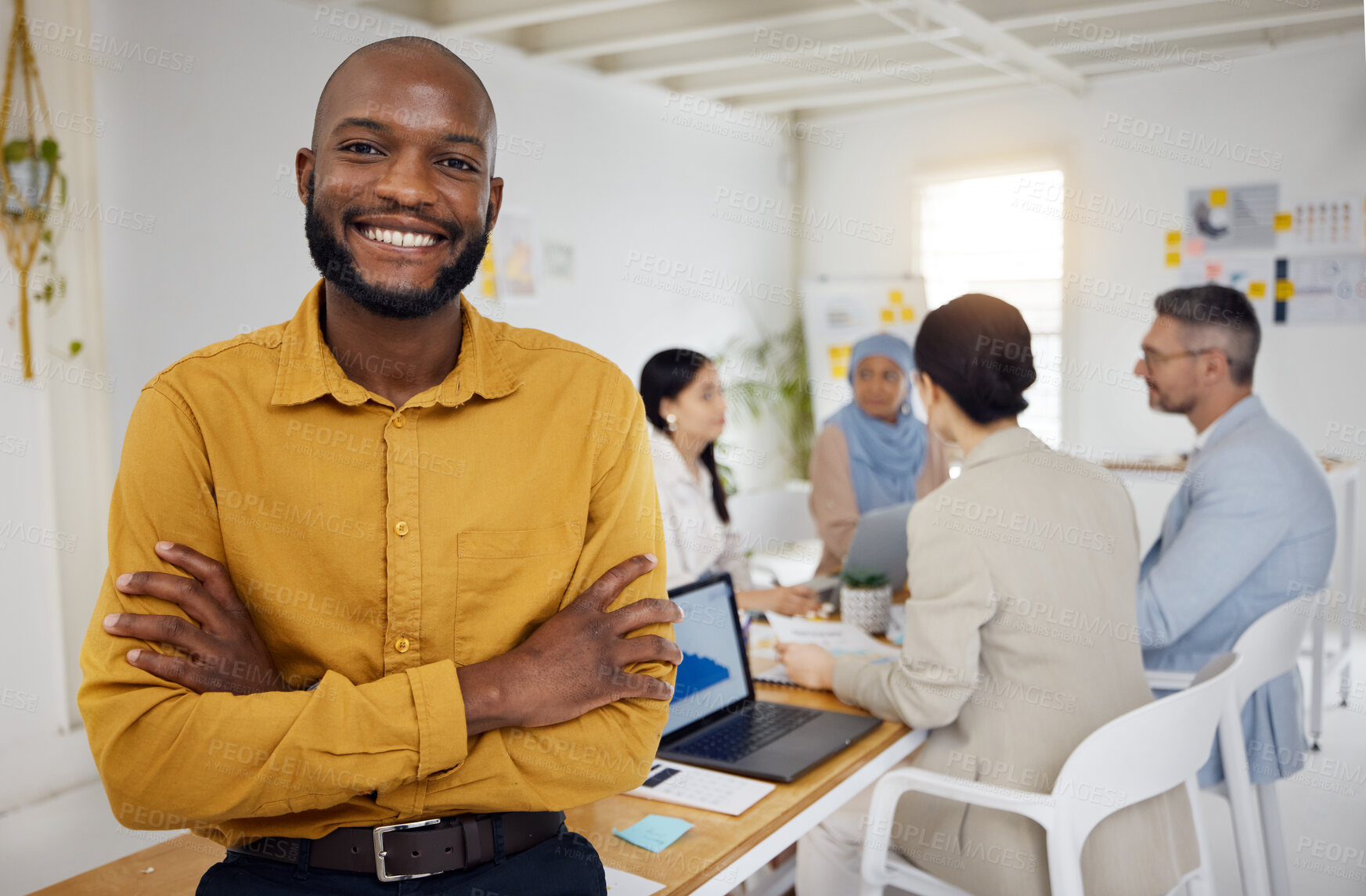 Buy stock photo Black business man, arms crossed and leader at meeting, company or ceo with pride, portrait and success. Young African entrepreneur, boss and startup manager with smile, group and workshop at agency