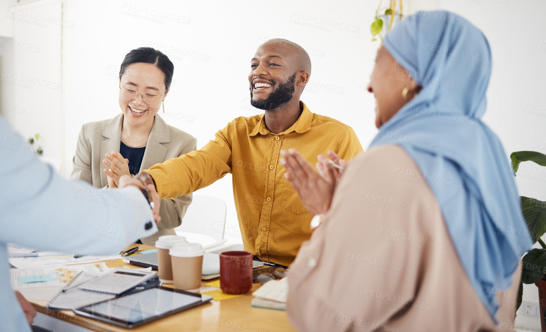 Buy stock photo Creative people, handshake and meeting in applause for promotion, partnership or teamwork at office. Happy employees shaking hands in team recruiting, agreement or deal in startup at the workplace