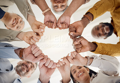 Buy stock photo Team building, fist bump and business people portrait in office for teamwork, support or faith from below. Diversity, hands and team face together sign for union, trust and partnership or motivation