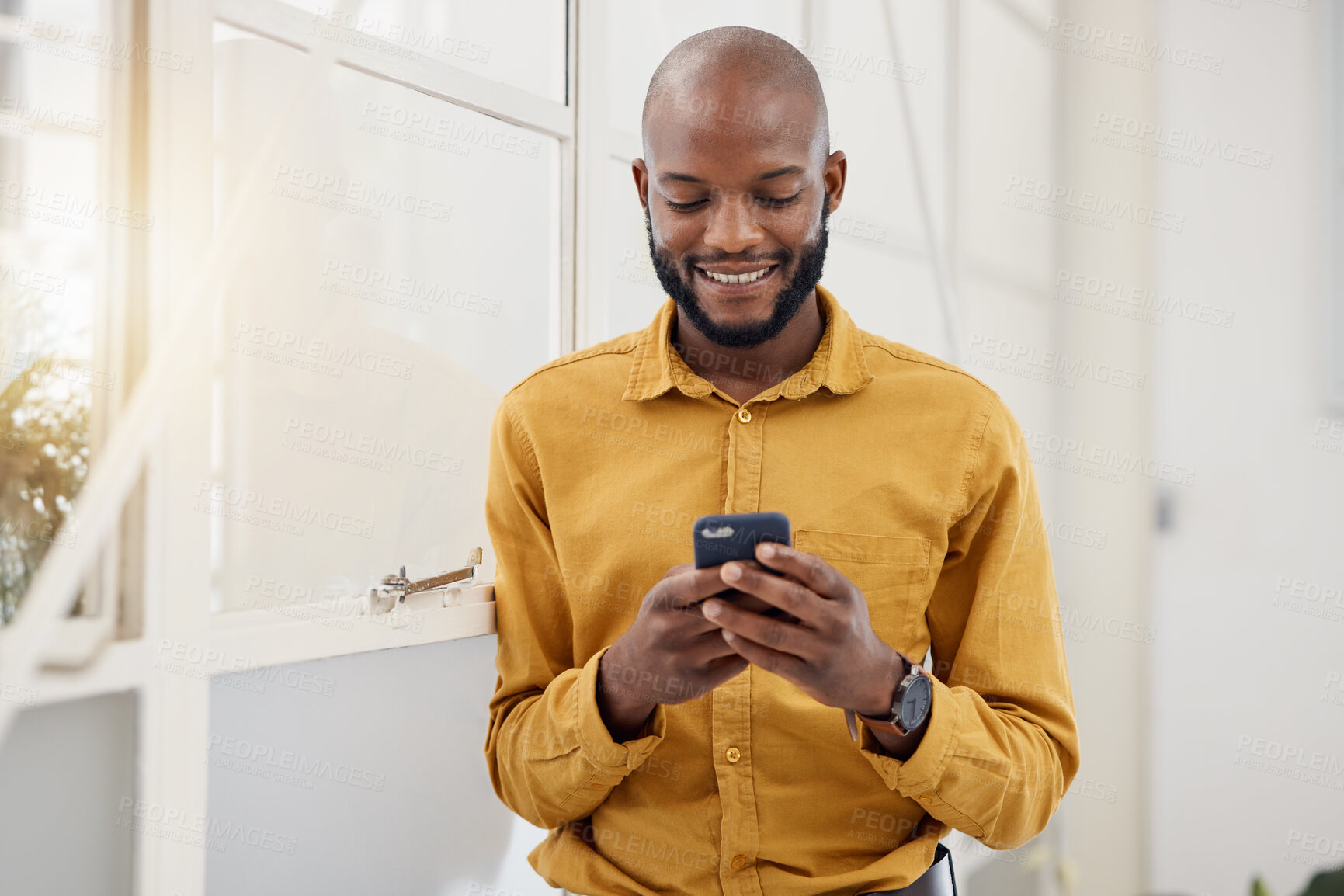 Buy stock photo Business, happy black man and typing with phone in office for social network, mobile website and internet contact. Employee scroll on smartphone chat, reading news app and notification of information