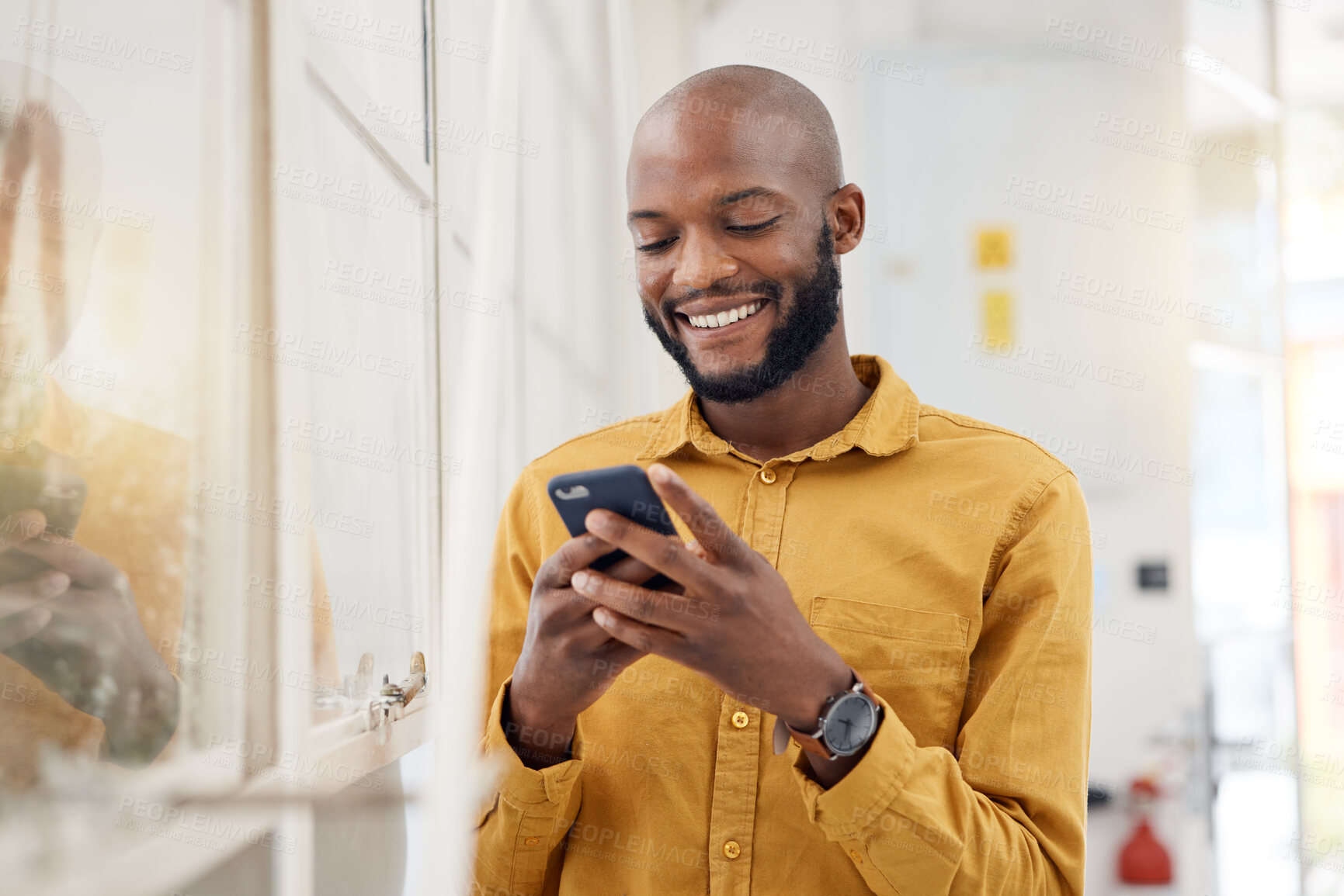 Buy stock photo Happy black man, smartphone and typing in office for social media, networking and mobile contact. Business employee smile with cellphone, reading tech notification and information on digital news app