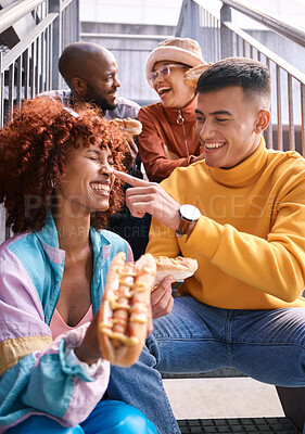 Buy stock photo Hotdog, friends and people eating outdoor for travel, funny laugh and fun on stairs. Diversity, happiness and gen z group of men and women with food on date, adventure and touch nose in urban town