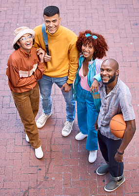 Buy stock photo Happy friends, city and portrait with a basketball outdoor for sports, fashion and fun. Diversity, gen z and student group of men and women smile for adventure and relax on urban street from above