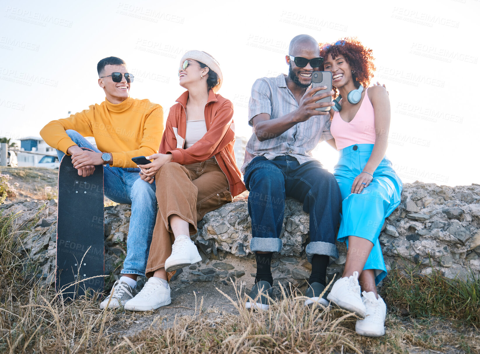 Buy stock photo Gen z, friends and relax outdoor with phone, vacation and skateboard for selfie, memory and conversation in nature. Young men, women and students with smile, smartphone and summer memory in Cape Town
