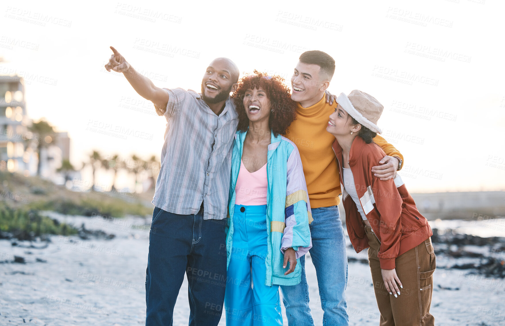 Buy stock photo Beach, friends and people with view, gen z and fashion with smile, pointing and travel with hug outdoor. Happy in nature, ocean and urban streetwear style, adventure and friendship with students