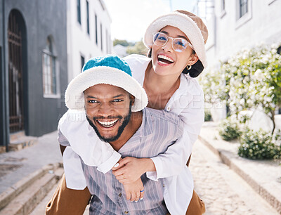 Buy stock photo Happy couple, love or piggyback portrait in city to travel on romantic date to play a funny outdoor game. Smile, interracial or happy man carrying gen z woman in silly, goofy or playful joke together