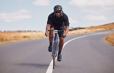 Portrait, street and man on a bike for fitness, countryside cycling or training for a competition. Serious, sport and a male cyclist with a bicycle in the road for a race, adventure or nature cardio
