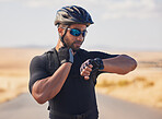 Fitness, cycling and man checking pulse at race, marathon or competition training in nature. Sports, workout and young male athlete timing his heart rate for health at an outdoor cardio exercise.