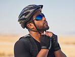 Cycling, sports and fitness with man and helmet in road for training, challenge and performance, Health, workout and wellness with person and safety gear in nature for freedom, adventure and exercise