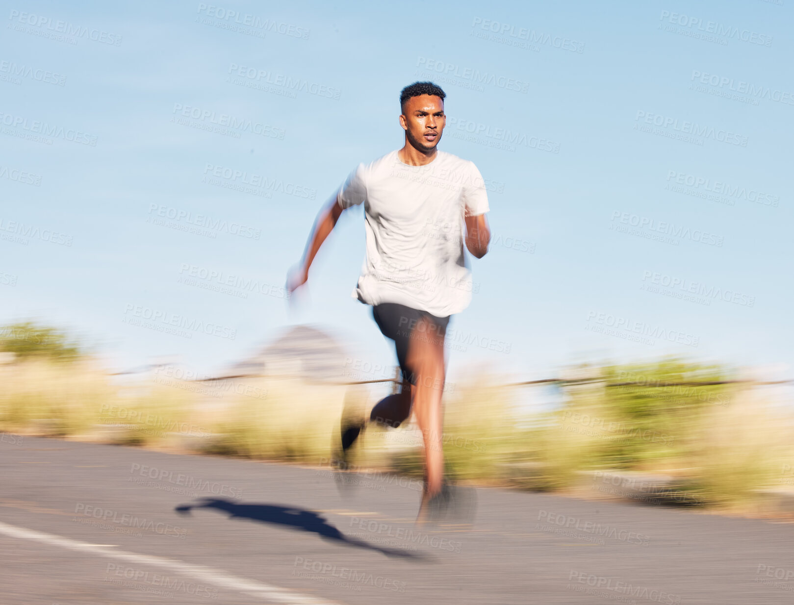 Buy stock photo Man, training and running on road in mountain, nature or outdoor exercise and athlete moving with speed, motion or workout. Male, fitness and runner in morning cardio, sports or goals for wellness