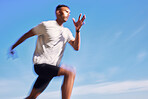 Fitness, exercise and speed of a man running outdoor for workout or training. Blurred athlete person or runner in nature for resilience, cardio performance or health and wellness on sky mockup space