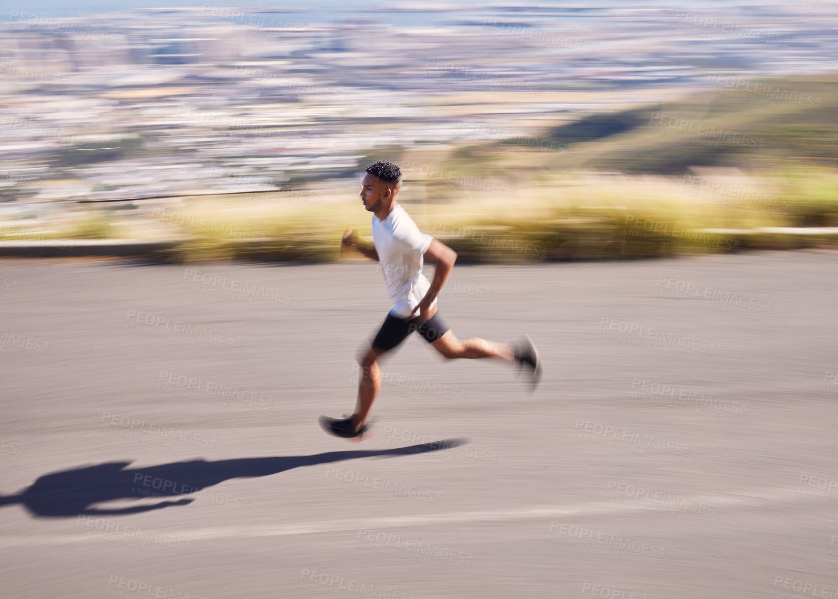 Buy stock photo Fitness, running and motion blur with a sports man on a road for his cardio or endurance workout. Exercise, health and a runner training for a marathon or challenge in the mountains during summer