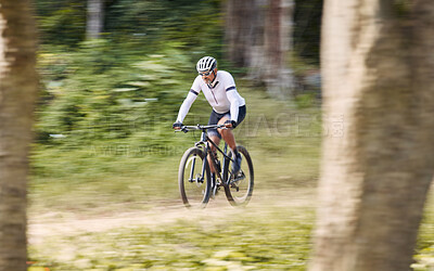 Forest blur, mountain bike and sports man cycling, action and ride bicycle for cardio, fitness or transportation. Sustainable, green nature trees and cyclist training, speed and travel in woods path