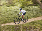 Fitness, sports and man cycling in forest for speed, training or nature workout with top view off road race. Freedom, workout and cyclist on mountain bike for extreme, adrenaline or power performance