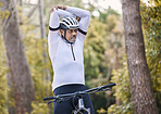 Nature, cycling and sports man stretching for exercise ride, fitness and journey on outdoor mountain bike challenge. Warm up, retirement wellness and mature athlete start bicycle workout in forest