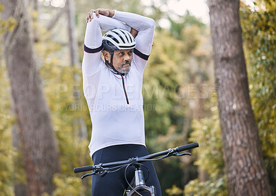 Buy stock photo Nature, cycling and sports man stretching for exercise ride, fitness and journey on outdoor mountain bike challenge. Warm up, retirement wellness and mature athlete start bicycle workout in forest