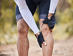 Fitness, knee pain and man hands in forest with cycling, sports or injury, muscle or joint accident outdoor. Leg, arthritis or athlete with fibromyalgia, emergency or cramps massage for osteoporosis 