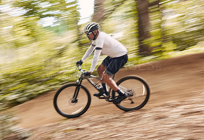 Buy stock photo Blur fast, cycling and man in nature training for a race, marathon or competition in forest. Adventure, fitness and cyclist athlete riding bicycle at speed on mountain for cardio exercise or workout.