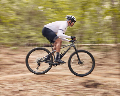 Buy stock photo Fitness, cycling and man with bicycle in a forest for speed, training or workout in nature for off road hobby. Extreme sports, mountain bike and cyclist in woods for workout or adrenaline performance