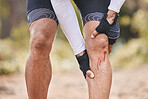 Fitness, knee pain and man with blood, injury or sports mistake in park for cycling, training or exercise accident. Bleeding, wound and cyclist with biking fail, joint or leg emergency or broken bone