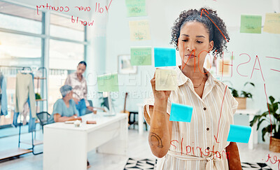 Buy stock photo Creative woman, fashion designer and writing in schedule planning, strategy or idea on glass board at the office. Female person in retail startup, project plan or brainstorming tasks at the workplace