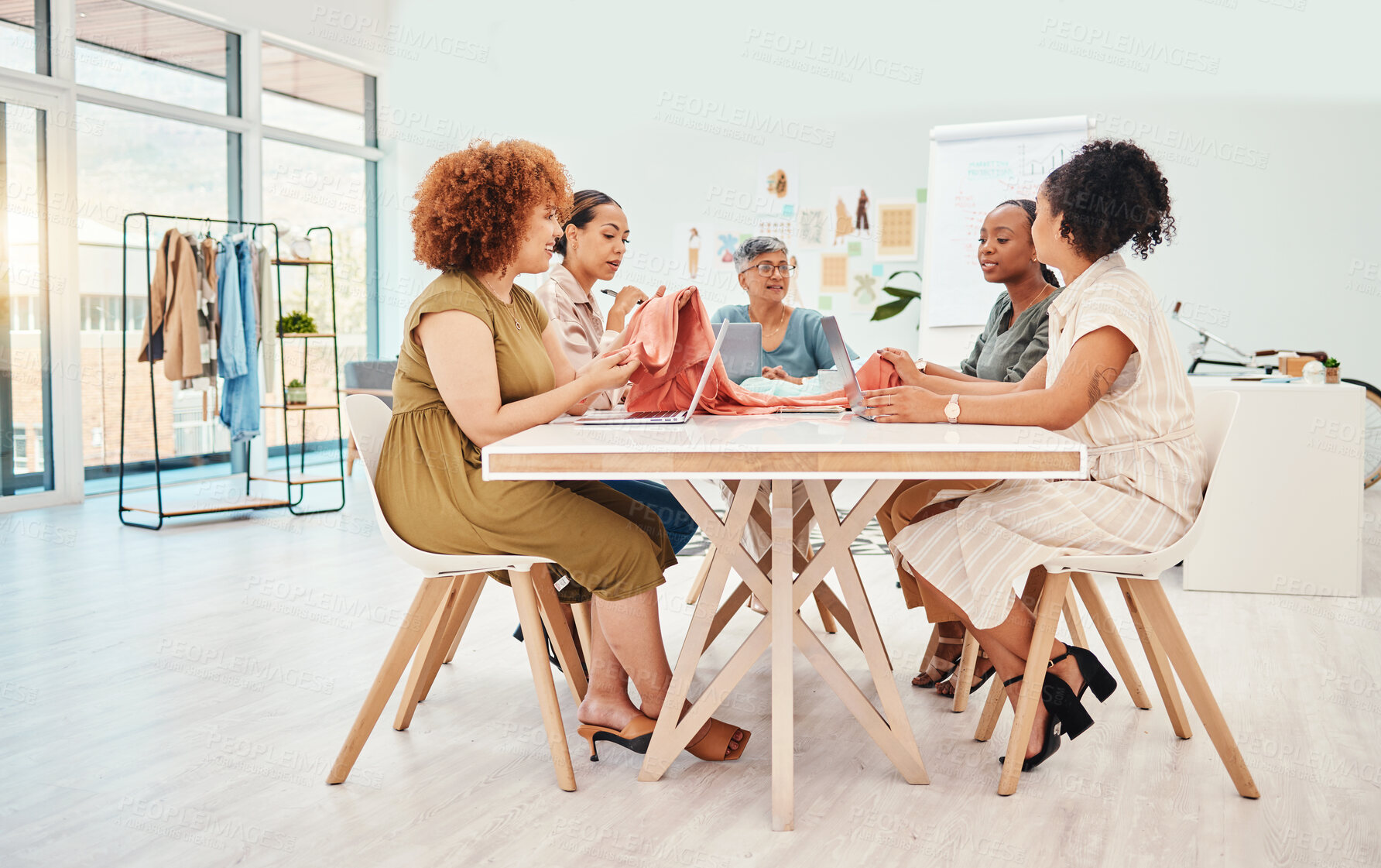 Buy stock photo Creative people, fashion design and meeting in brainstorming, team strategy or clothing ideas at office. Group of women designers in retail startup, project plan or teamwork discussion at workplace