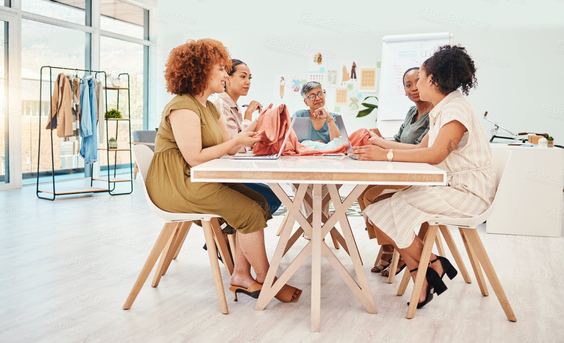 Buy stock photo Creative people, fashion designer and meeting in brainstorming, team strategy or clothing ideas at office. Group of women in retail startup, project plan or teamwork discussion in design at workplace