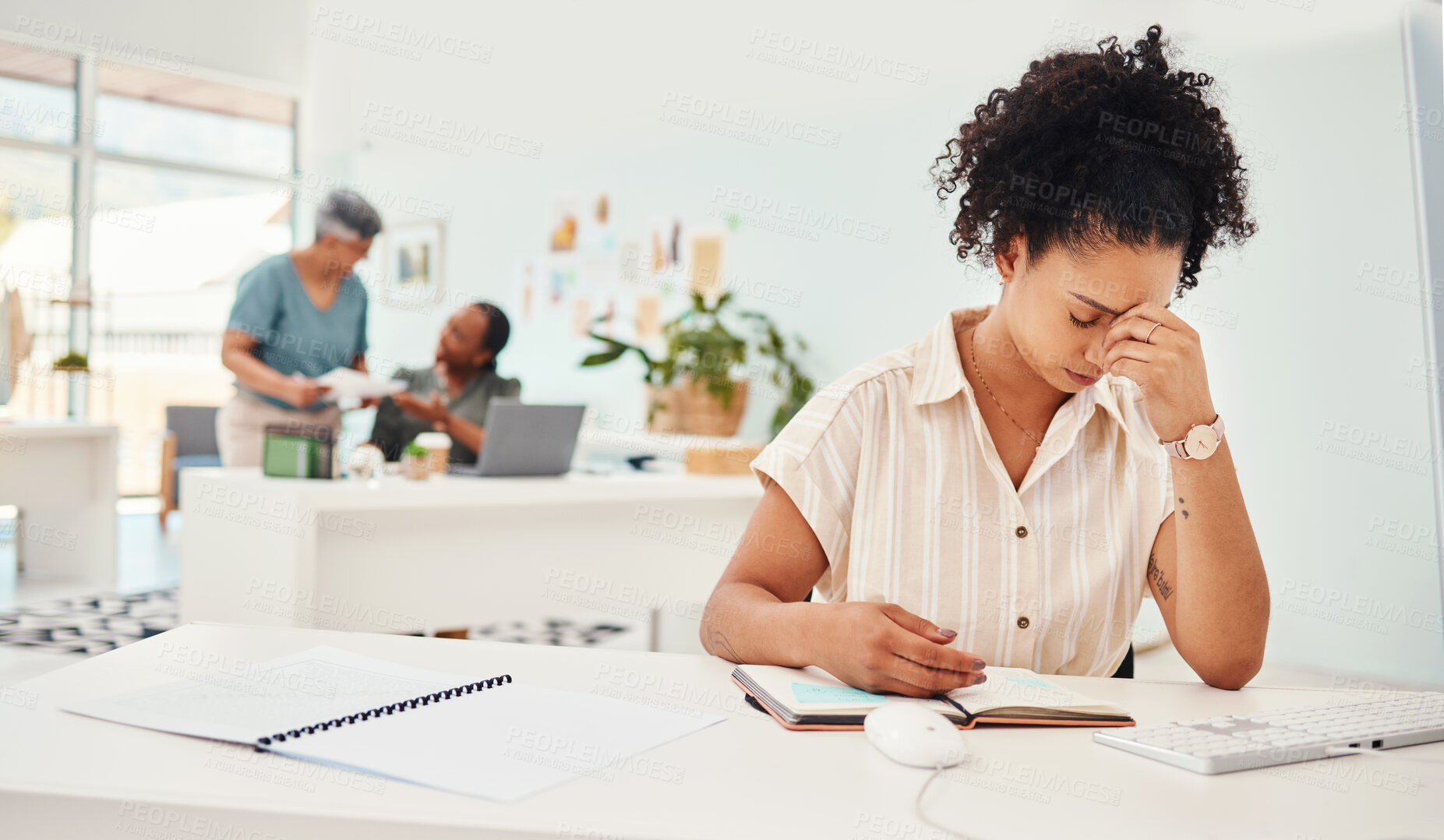 Buy stock photo Anxiety, headache and a business woman writing in her notebook while working to a deadline in the office. Stress, depression and compliance with a young fashion designer planning an artistic project