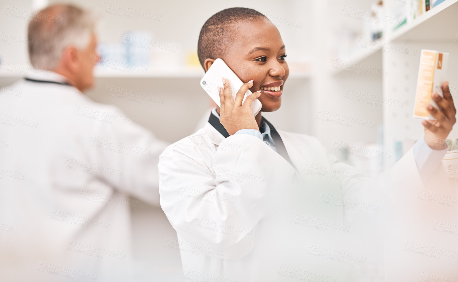 Buy stock photo Pharmacy, phone call and woman with medicine box while reading information. African person or pharmacist talking on smartphone for telehealth, consultation or customer service and product label