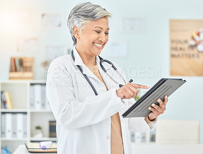 Buy stock photo Woman, doctor and results on tablet from test, medical research or mature professional surgeon planning with tech. Medicine, mobile app and happy mature healthcare worker on social media or internet