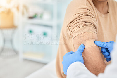 Buy stock photo Bandaid, vaccine and patient with doctor for healthcare, first aid bandage or medical consultation for covid injection. Hands, hospital nurse and plaster for an injury, virus or injection in arm
