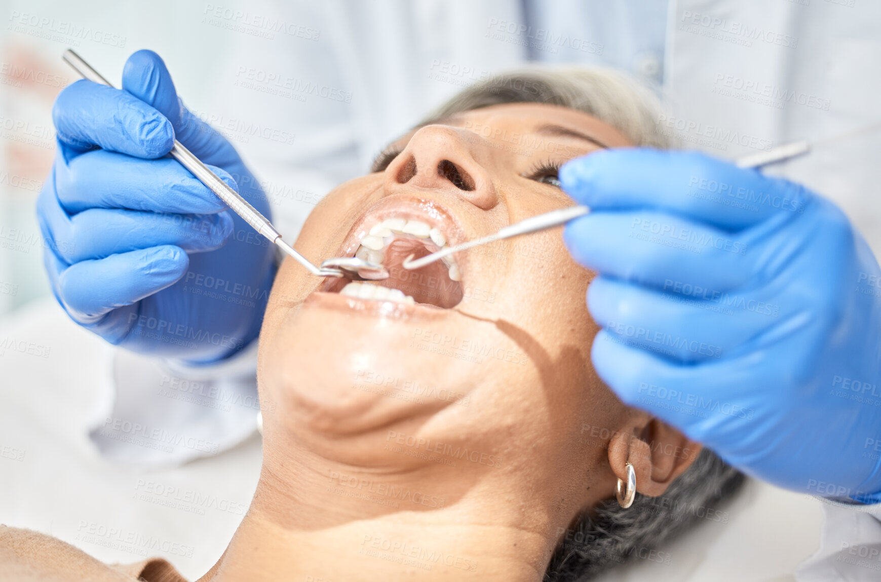 Buy stock photo Woman, mouth and dentist hands with tools, medical and dental procedure, healthcare and closeup. Oral health, orthodontics and patient with doctor, teeth whitening and veneers with metal instrument