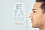 Man, face and clinic eye exam for vision, optometry and wellness for prescription lens on space. Closeup person, thinking and serious patient in optometry, ophthalmology and assessment for eyesight