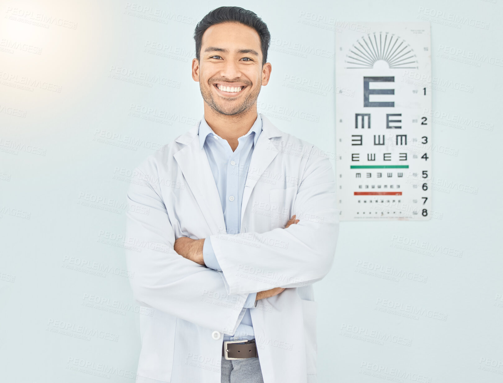 Buy stock photo Ophthalmologist, portrait and man with arms crossed in hospital mockup space for healthcare of vision. Face, confident optometrist and happy doctor, Asian optician or medical professional in Cambodia