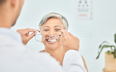 Buy stock photo Smile, glasses and hands of ophthalmologist on woman in hospital for vision, healthcare or wellness. Frame, optometrist and mature patient happy for eyewear, lens or prescription spectacles in clinic