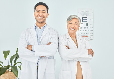 Buy stock photo Doctors, optometry and arms crossed, portrait and eye care with vision, help and optometrist team at clinic. Wellness, health and support, collaboration and confidence with Asian man and senior woman