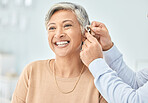 Senior patient, hearing aid and doctor hands, ear and listening, help and trust, healthcare and medicine. Medical tech, consultation with ENT specialist and health, happy woman and people at clinic