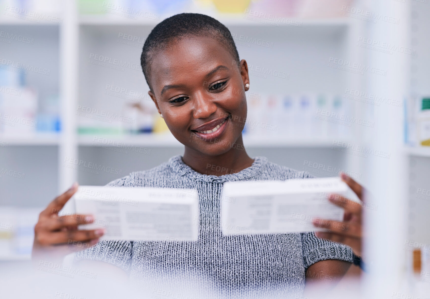 Buy stock photo Pharmacy, product choice and happy black woman, customer or client reading package, box or pharmaceutical label. Hospital clinic store, supplements pills or African person smile for medicine decision