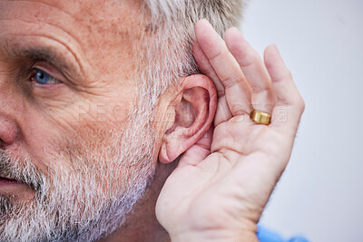 Buy stock photo Senior man, listening and hand on ear or curious guy with gesture to hear gossip, conversation or announcement. Hearing, loss and old person with a disability or deaf male with hands to listen