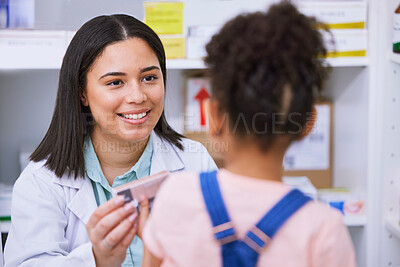 Buy stock photo Pharmacist, woman and child with medicine in pharmacy, pills or supplements, sick with help and retail. People in store, drugs and wellness, trust and healthcare, prescription medication and illness