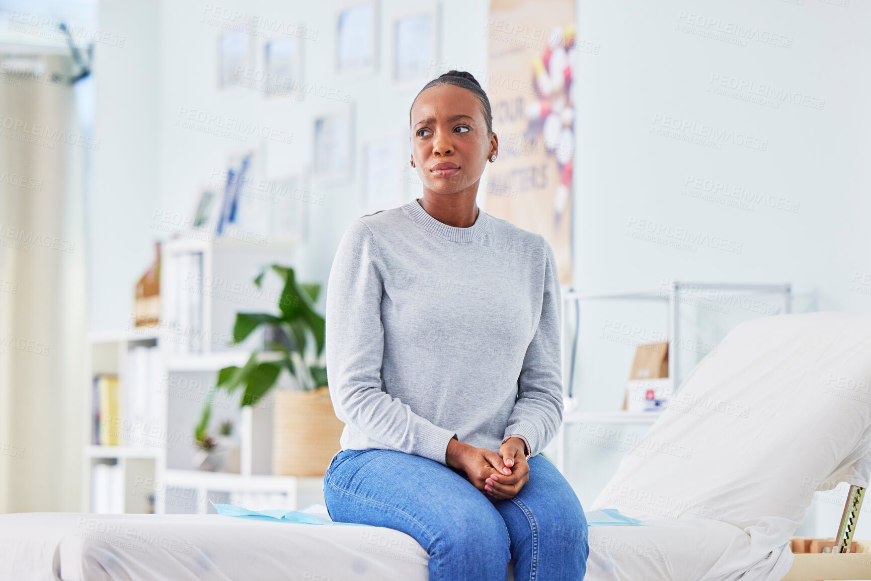 Buy stock photo Black woman, sick and patient waiting in stress on hospital bed for doctor in checkup, appointment or consultation. African female person with flu, fever or mental health in illness or clinic advice