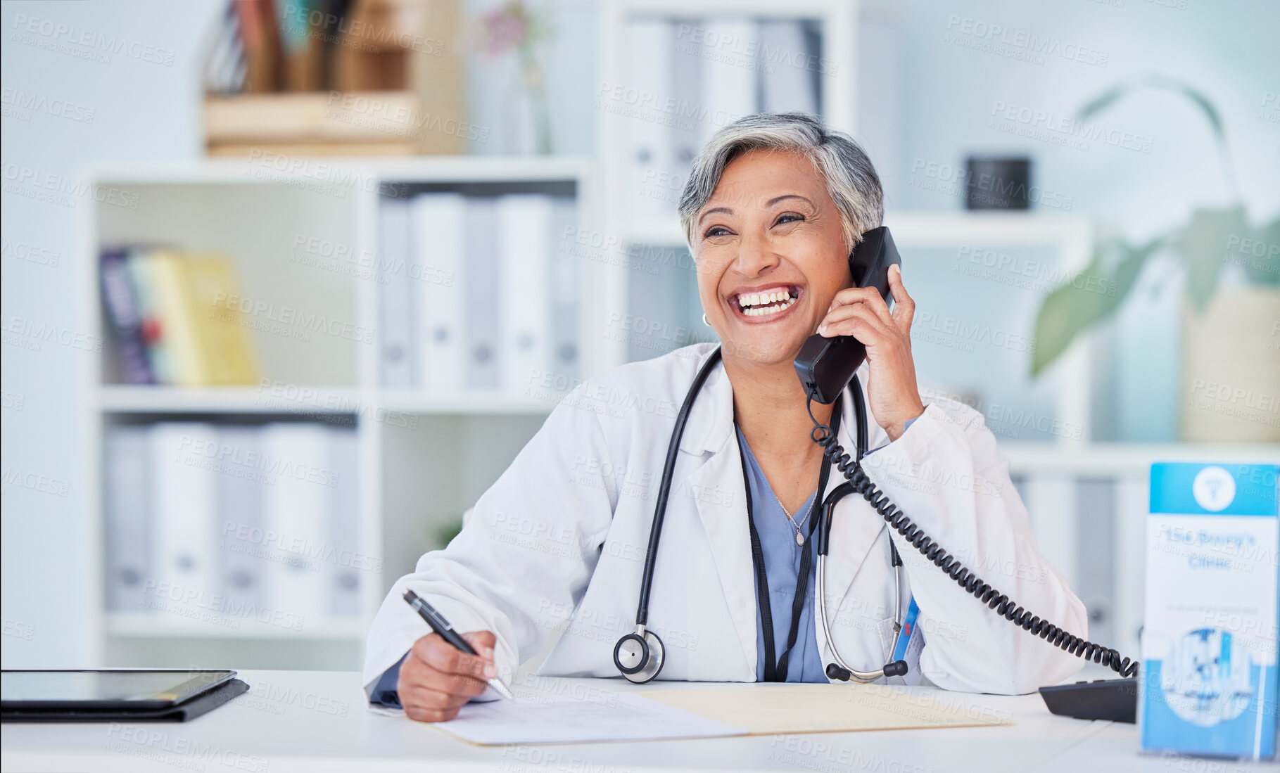 Buy stock photo Doctor, senior woman in office and phone call, telehealth and happy writing with health insurance and paperwork. Healthcare, wellness and communication, documents and information with compliance 