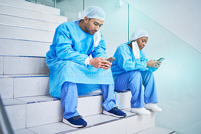 Buy stock photo Surgeon team, stairs and phone in hospital for telehealth, healthcare or online wellness. Smartphone, doctor and people on steps on internet, reading email and medical professional research in clinic