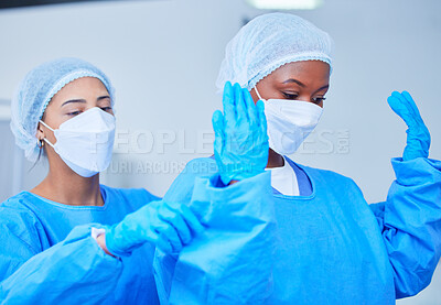 Doctor, theatre clothes and medical expert for surgery, operation, emergency and healthcare in hospital. Surgeon, women and professional nurse in teamwork and support for health, work and medicine