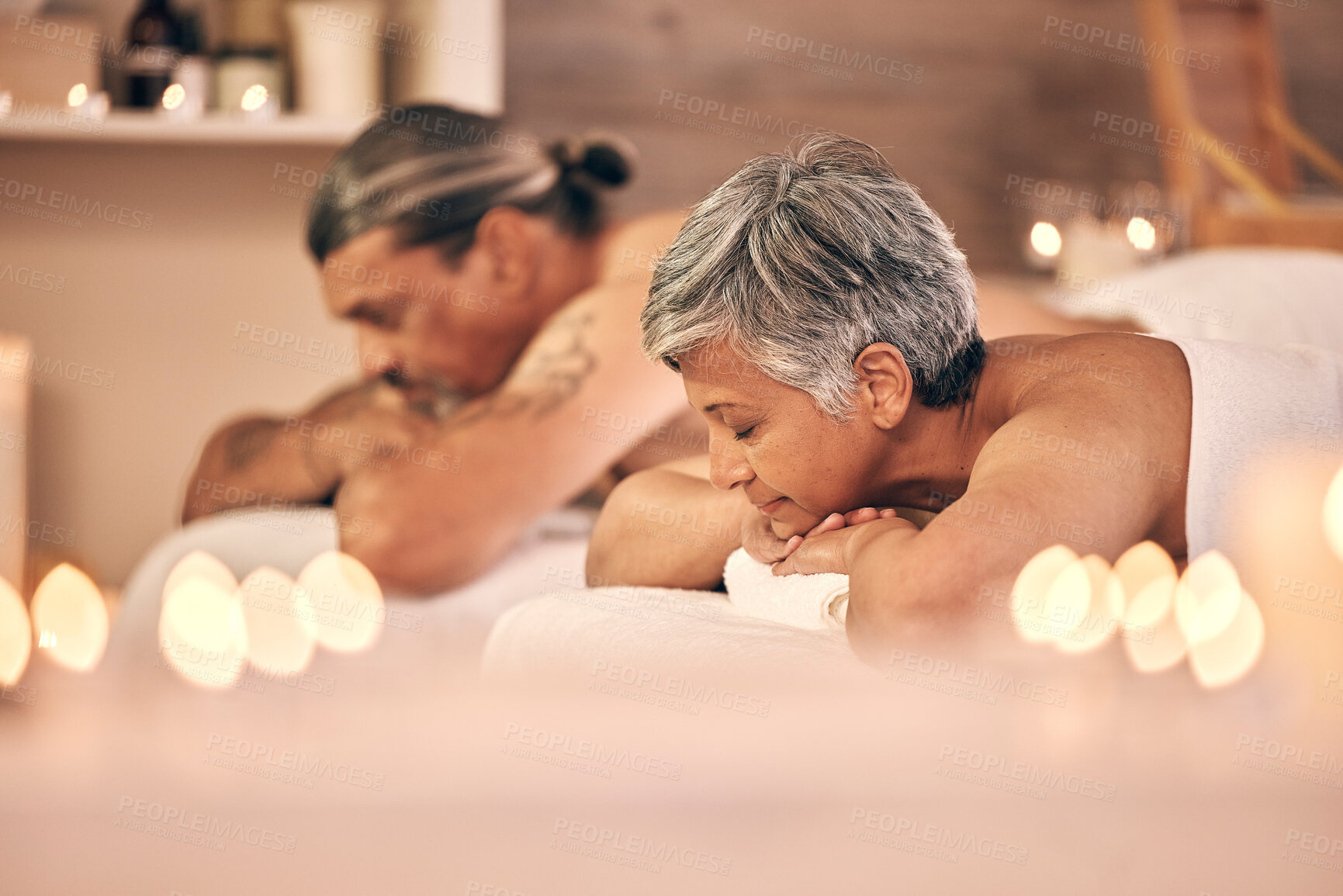 Buy stock photo Relax, massage and couple on bed in spa for holiday, vacation and anniversary celebration. Love, luxury resort and mature man and woman sleeping in salon for beauty, therapy and skincare treatment