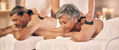 Buy stock photo Relax, hot stone and zen with old couple in spa for vacation, luxury and beauty salon. Peace, wellness and holiday with senior woman and man in hotel villa for retirement, massage and body care