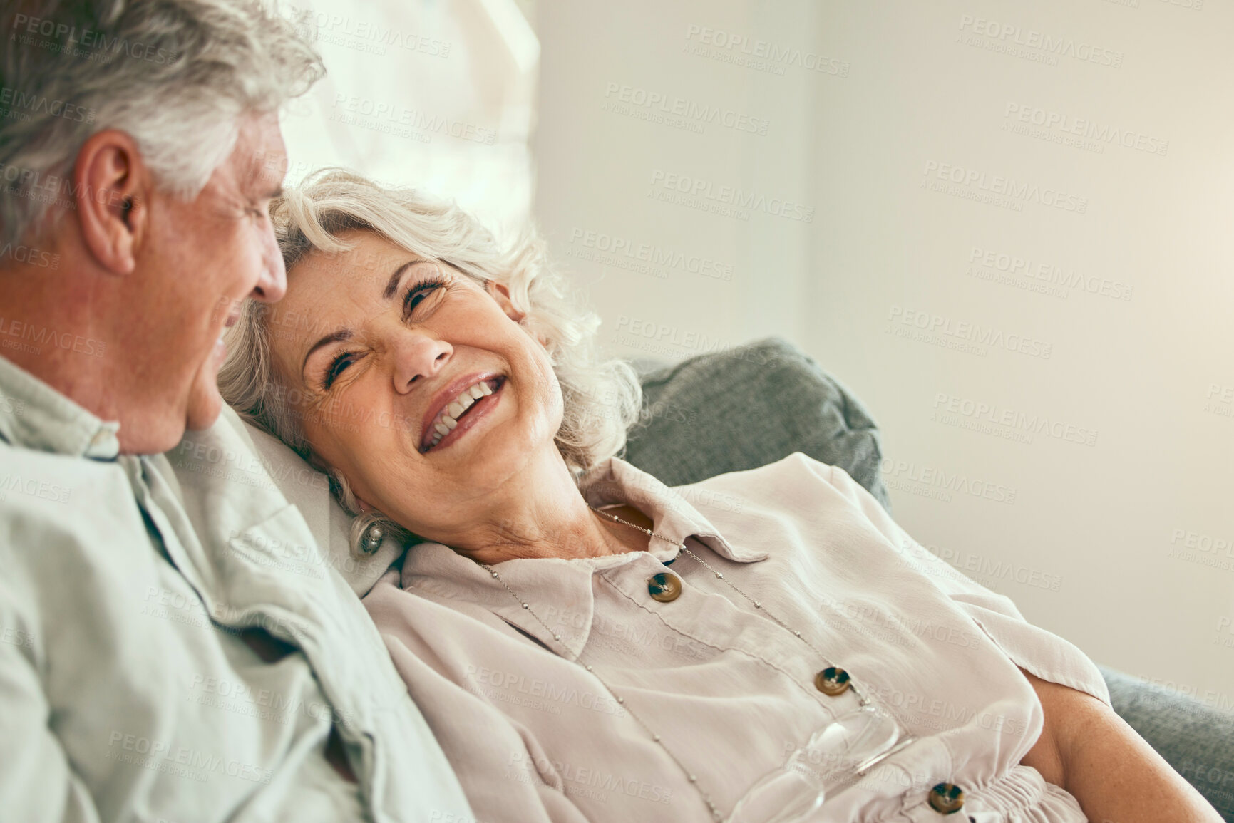 Buy stock photo Love, happy or old couple smile in home living room bonding together to relax on holiday with support or trust. Retirement, hug or senior man laughing with a mature woman with joy or care in marriage